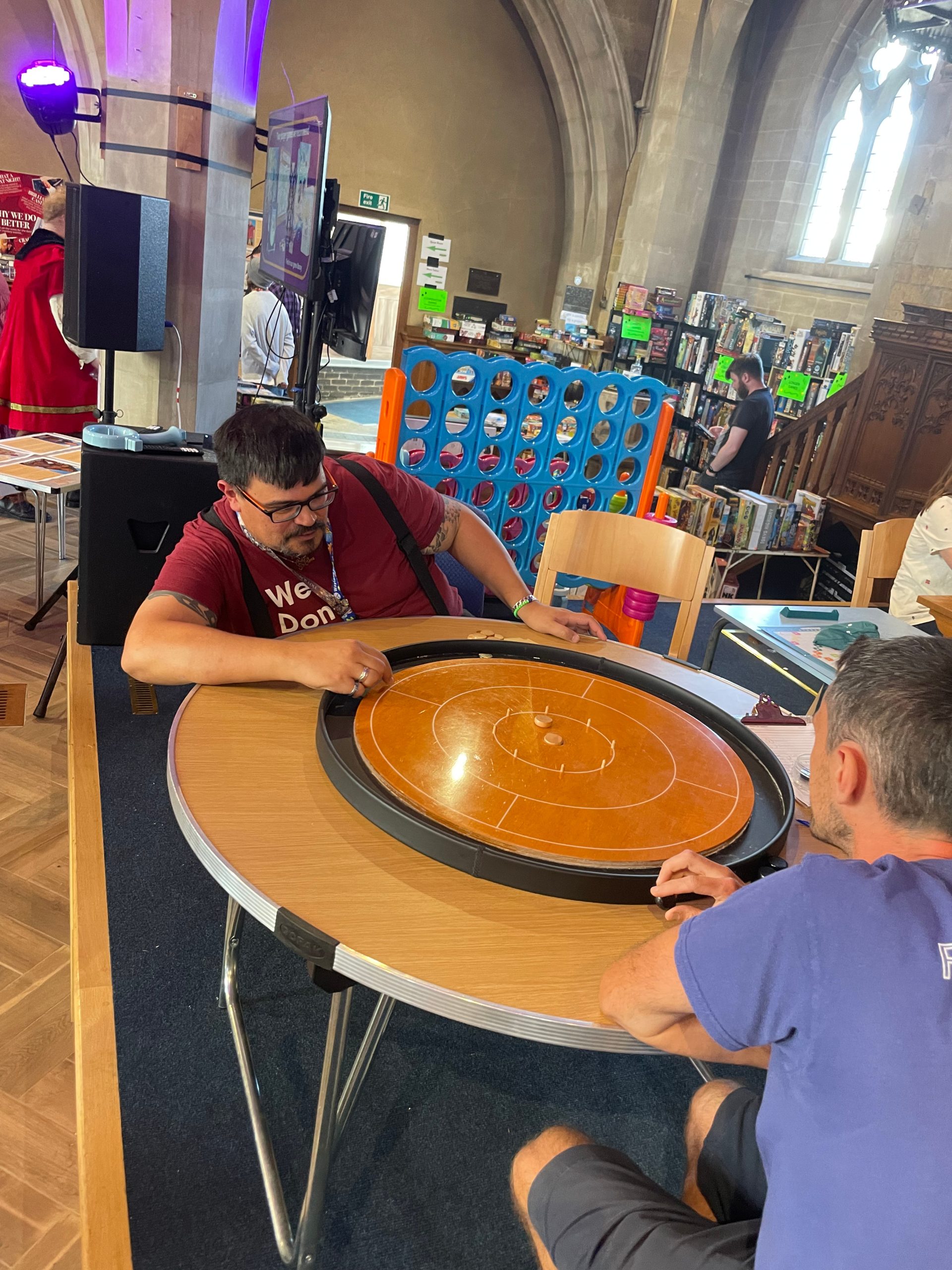 Crokinole is a Canadian dexterity game form the 19th Century played on a round board