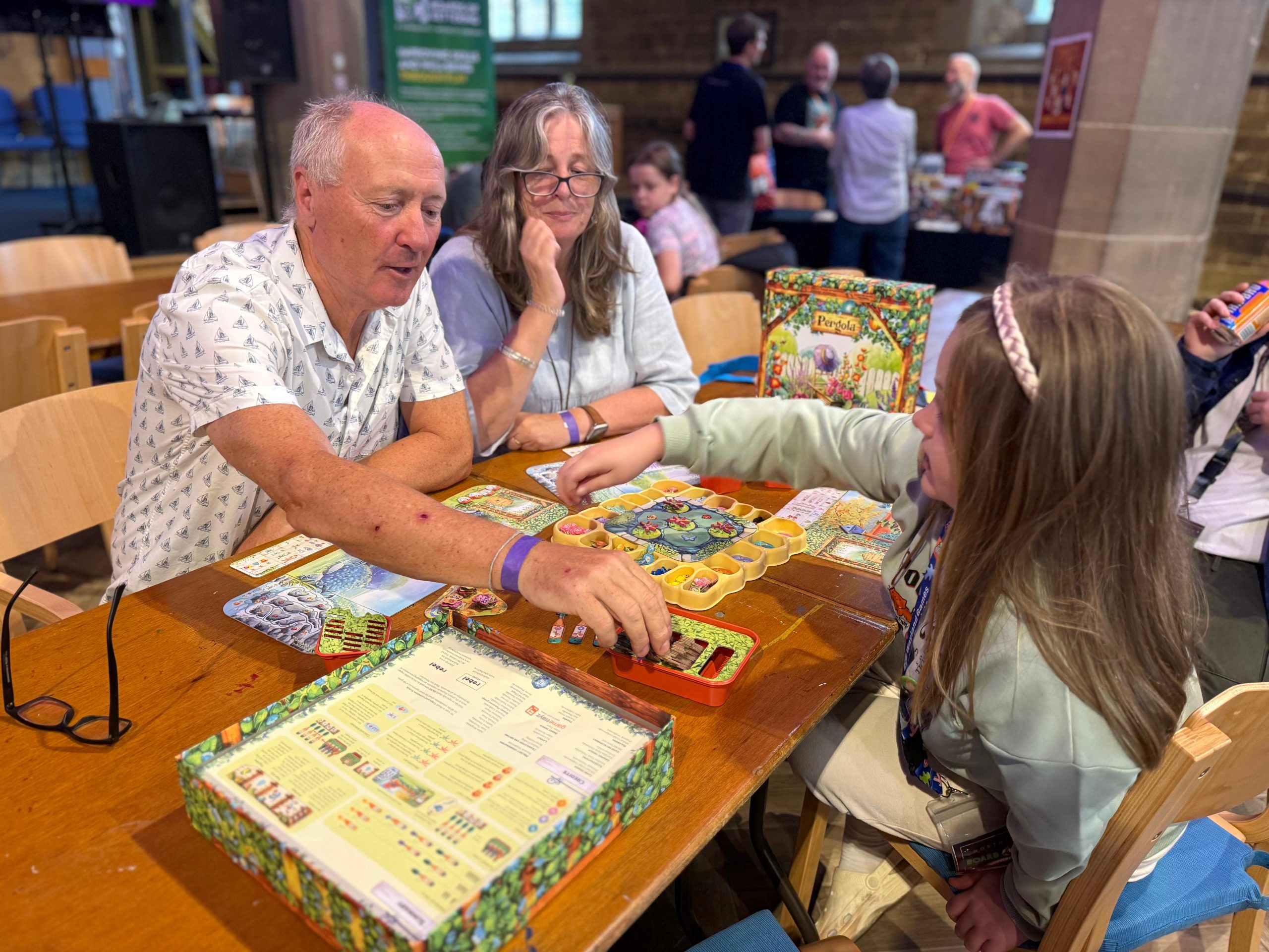 Grandparents and Granddaughter playing together